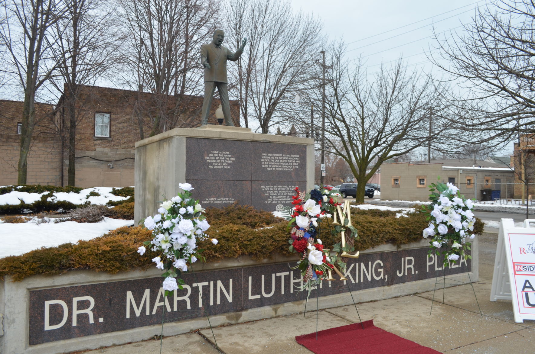 Wreath in front of statue